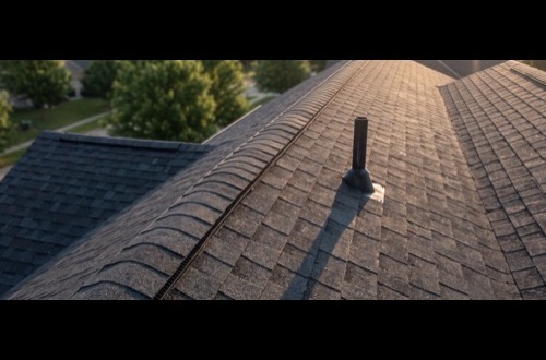 Roof ridge showing cut three-tab used as ridge cap
